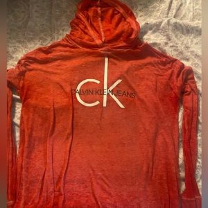 Calvin Klein womens loose sweatshirt/long sleeve with a hood. Worn with care
